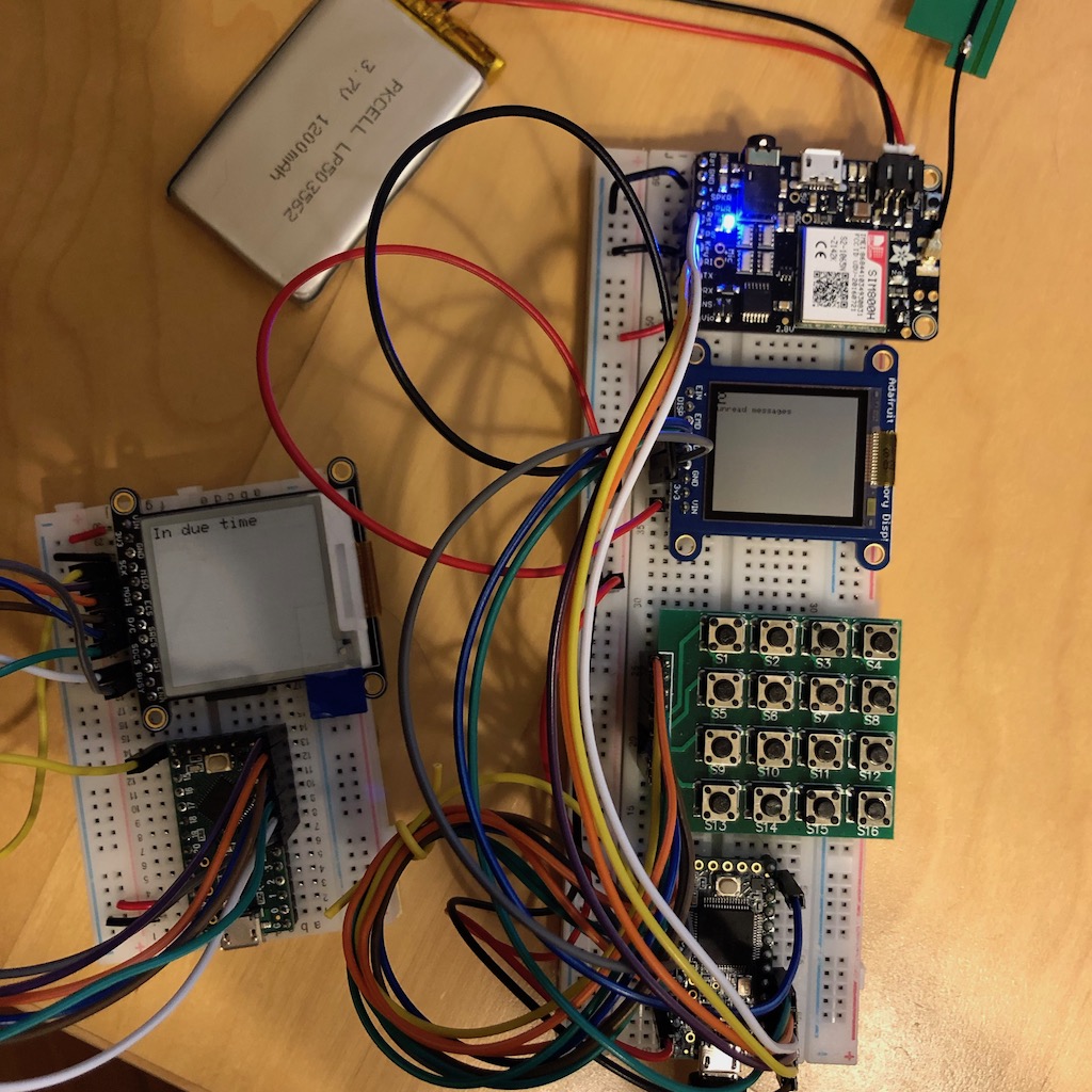 Prototype Phonium cell phone with new SHARP Memory Display beside repurposed EPD display and Teensy microcontroller